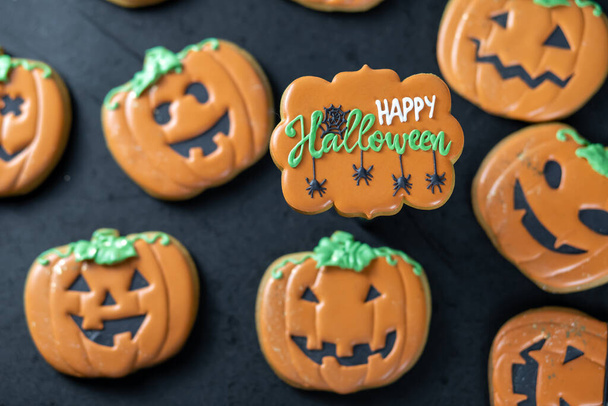 Bright Halloween gingerbread cookies on a black background - Zdjęcie, obraz