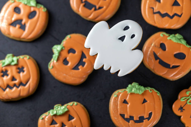 Bright Halloween gingerbread cookies on a black background - Photo, Image