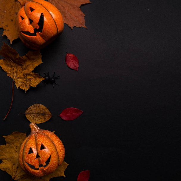 Happy Halloween layout, jack lantern on toy and autumn maple leaves. - Photo, image