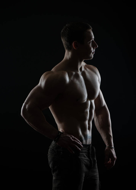 Fitness male model in studio - Foto, Imagen