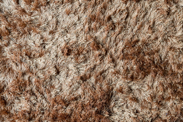 Barna szövet szőnyeg hosszú bolyhos textúra háttér - Fotó, kép