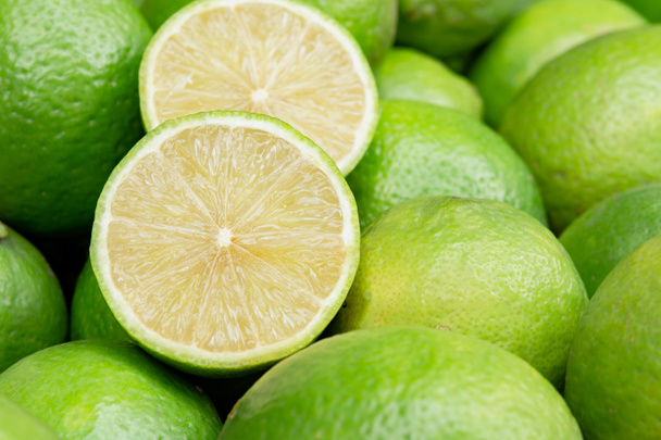Lime slice citrus fruits background. Fresh juicy limes. Healthy foo - Фото, зображення