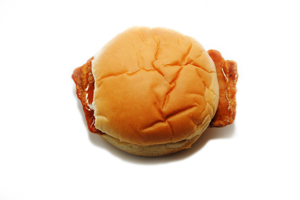 Vista superior da carne de porco desossada em um pão macio
 - Foto, Imagem