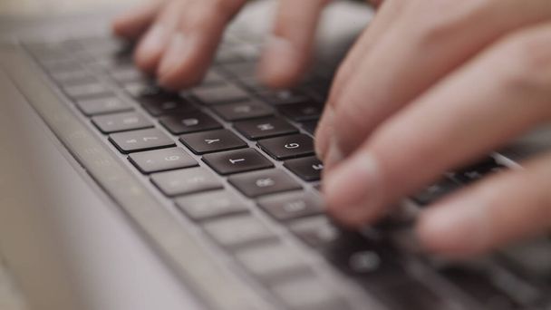 Close up macro of hands typing on laptop keyboard mac computer - Photo, Image