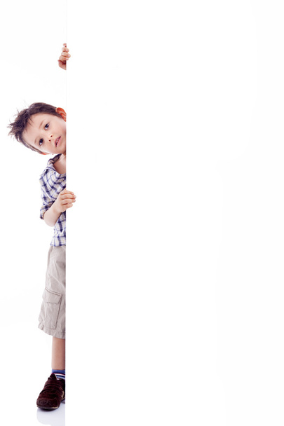 Kid holding white board - Valokuva, kuva