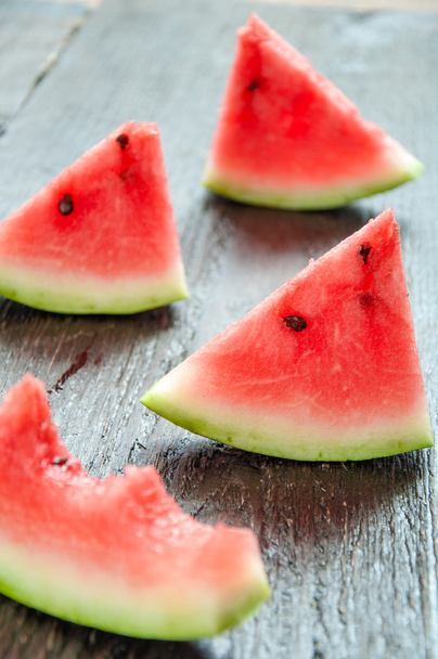 Ripe watermelons on table on the wooden background - Photo, image
