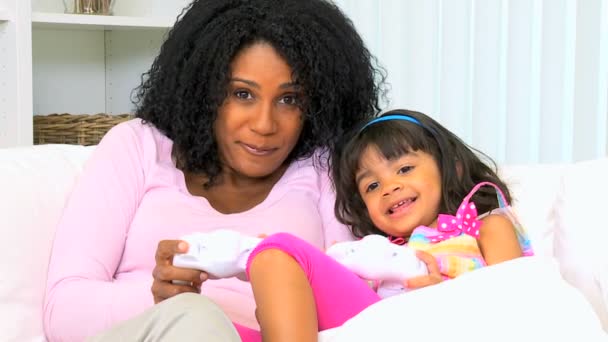 mother with daughter playing video games - Footage, Video