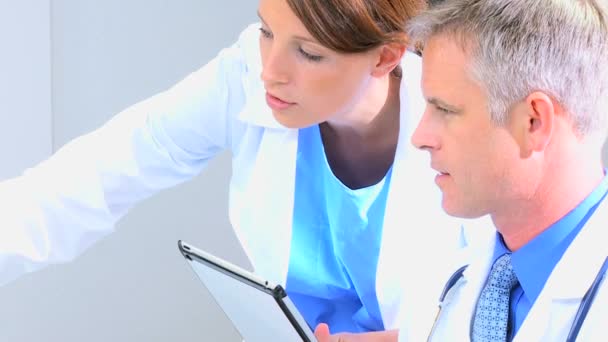 doctors using wireless tablet in medical office - Footage, Video