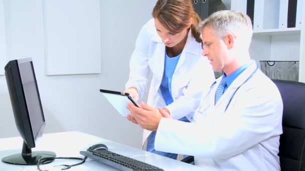 doctors using wireless tablet in medical office - Footage, Video