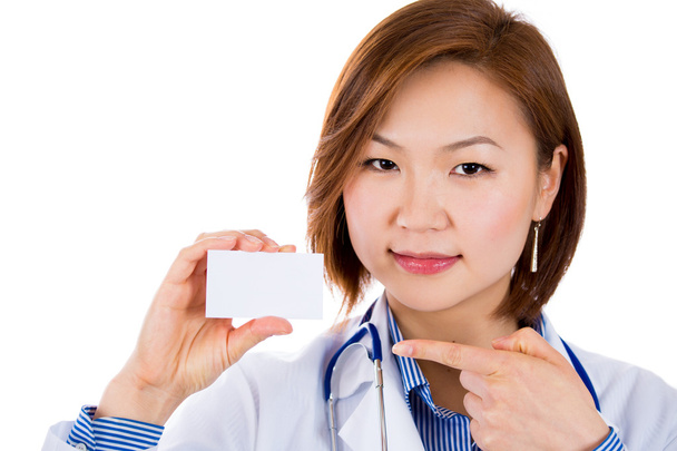 Doctor pointing on blank business card - Фото, изображение