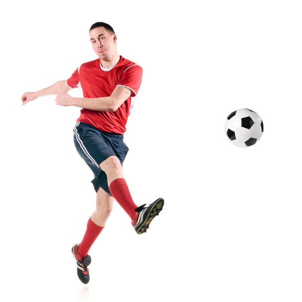 Soccer player hits the ball - Φωτογραφία, εικόνα