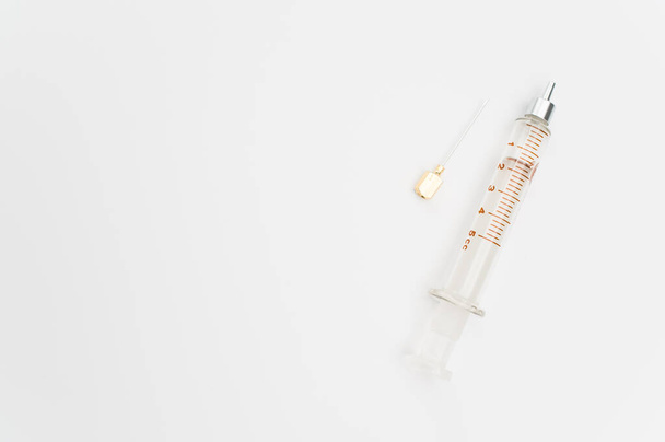 an isolated injection syringe on white paper background with text space - Фото, зображення