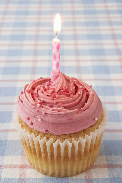 A cupcake with a candle - Foto, Imagen