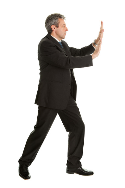 Portrait of business man pushing copy-space - Фото, изображение