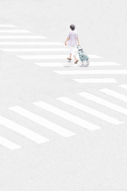 young woman walking on road - Фото, изображение