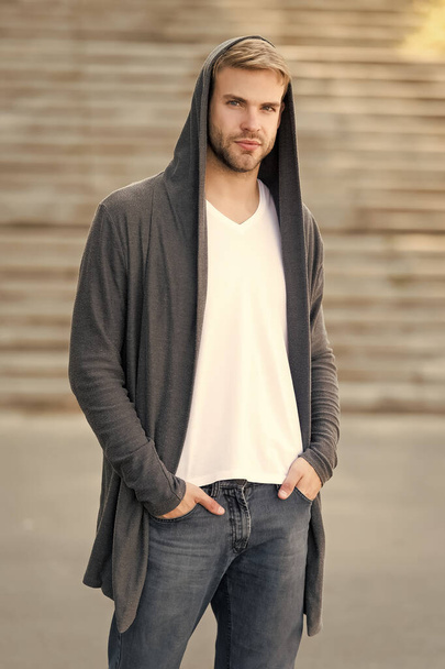 dangerously handsome. man in hood. hooligan wear hoodie. looking like thief in hooded cardigan. Casual style. concept of danger and confidence. Urban fashion look. city modern life. man in hoody. - Zdjęcie, obraz