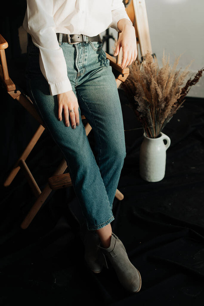 stylish fashionable blue jeans close-up young girl posing in studio - Foto, Imagem
