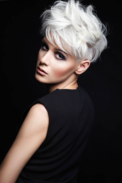 fashion beauty portrait of young woman with stylish haircut. beautiful blond girl with short hair and salon hairstyle - Zdjęcie, obraz