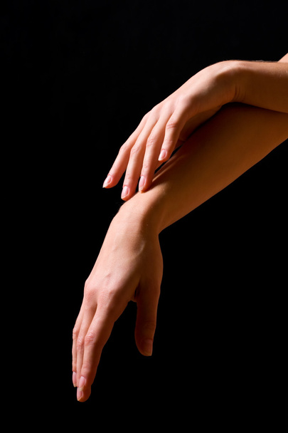 Sensual hands on a black background - Photo, Image
