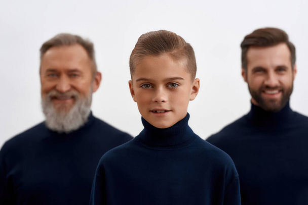 Portrait of smiling boy child with father and grandfather - Foto, afbeelding