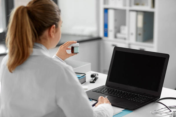 doctor with laptop having video call at hospital - Φωτογραφία, εικόνα