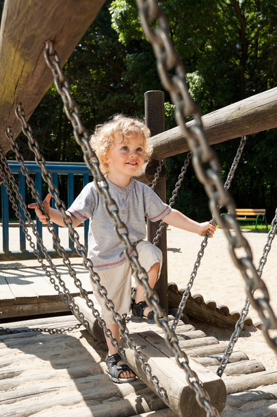 Boy having fun on the playground - Φωτογραφία, εικόνα
