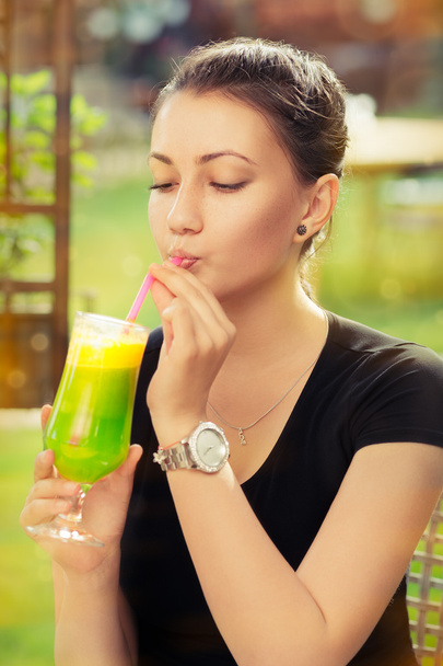 Young Woman with Colorful Cocktail Drink Outside - Φωτογραφία, εικόνα