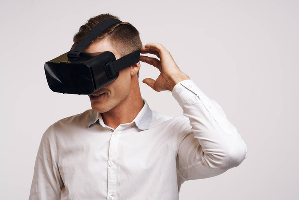 pretty man virtual reality glasses high-tech simulator technology studio - Photo, Image