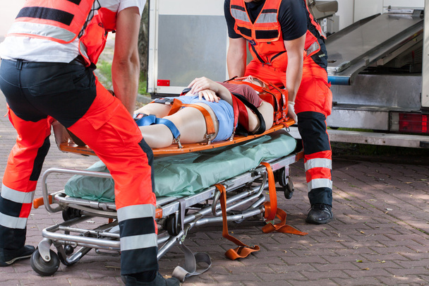 Woman after accident on the stretcher - Fotó, kép