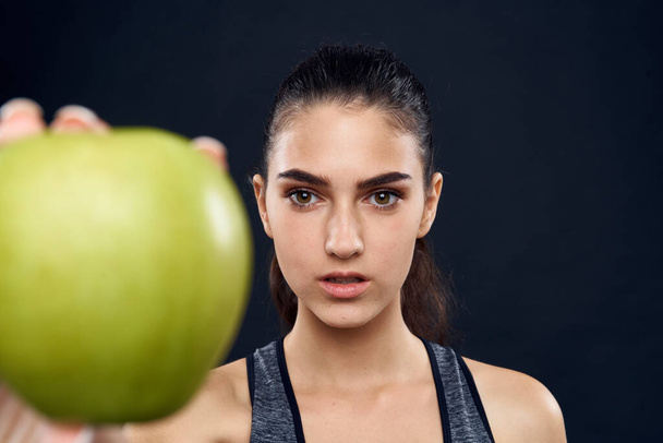 athletic woman slim figure green apple health - 写真・画像