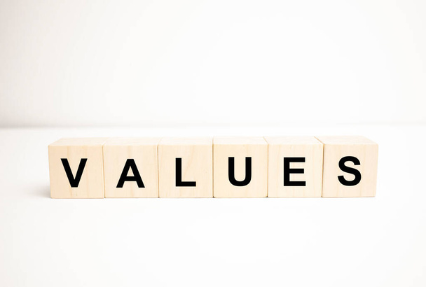 values word concept. wooden cubes, notepad, pen and business charts. - Фото, зображення
