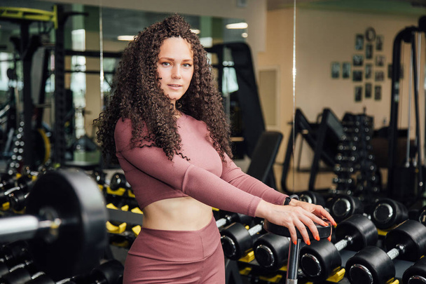 Young woman workout in gym healthy lifestyle. - Φωτογραφία, εικόνα