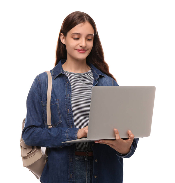 Teenage student with laptop and backpack on white background - Photo, image