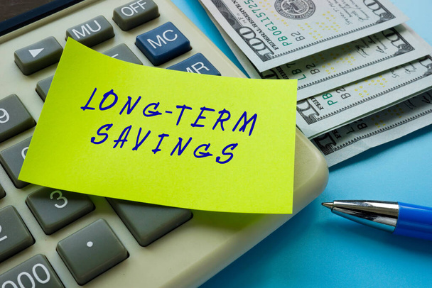 Business concept about LONG-TERM SAVINGS with phrase on the piece of paper. - Photo, Image