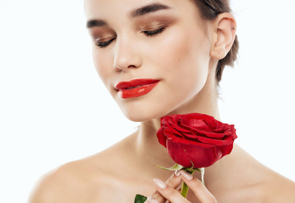 pretty woman bright makeup rose in hand clean skin posing - Photo, Image