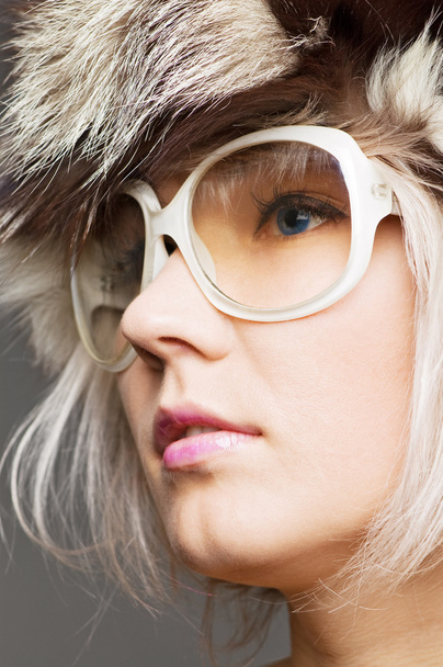 Young beautiful blond in fur hat and sunglasses - Φωτογραφία, εικόνα