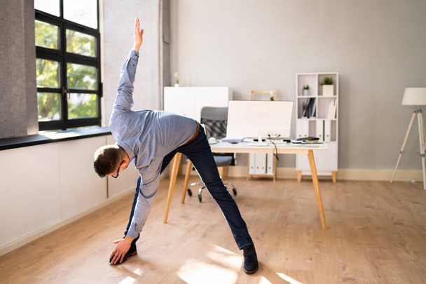 Arms Stretch Exercise Standing In Front Of Computer - Φωτογραφία, εικόνα