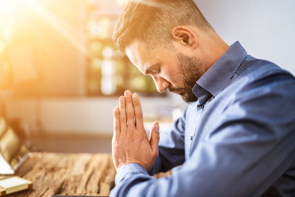 Praying Man. Christian Prayer Seeking God In Living Room - Foto, Bild