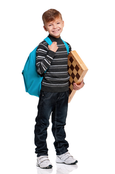 Boy with backpack and chessboard - Φωτογραφία, εικόνα