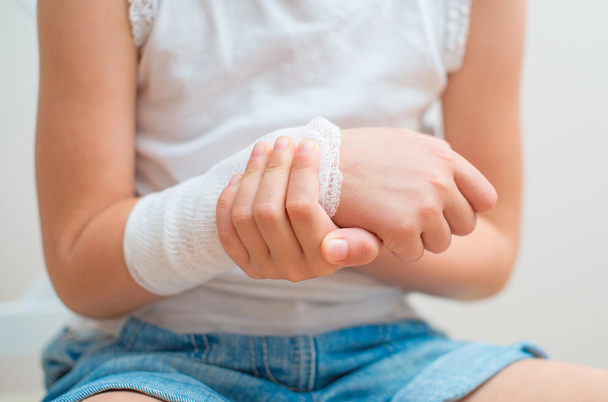 Child arm with gauze bandage on it. - Photo, Image