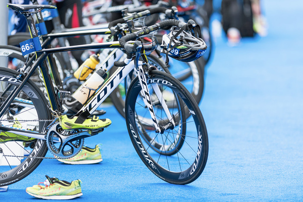 Row of triathlon bikes with all other equipment - Photo, Image