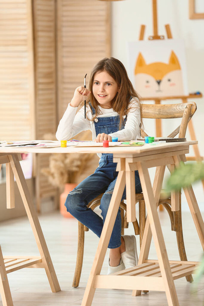 Cute little girl painting at home - Φωτογραφία, εικόνα