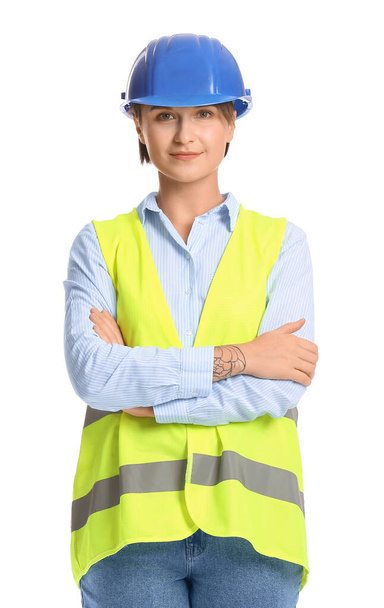 白い背景に硬い帽子の女性建設労働者 - 写真・画像