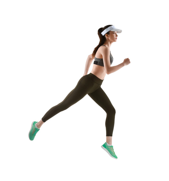 Deportiva mujer corriendo sobre fondo blanco
 - Foto, imagen