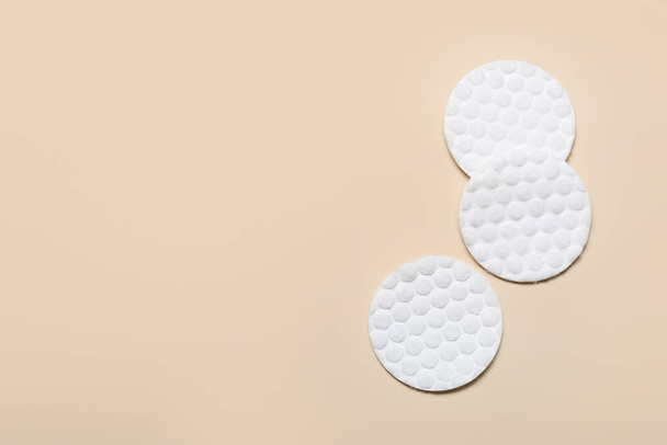 Clean cotton pads on beige background - Фото, изображение