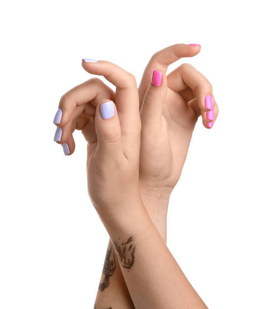 Woman with stylish different color manicure on white background - Foto, Bild