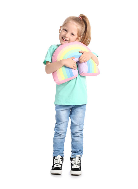 Funny little girl hugging toy rainbow on white background - Photo, image