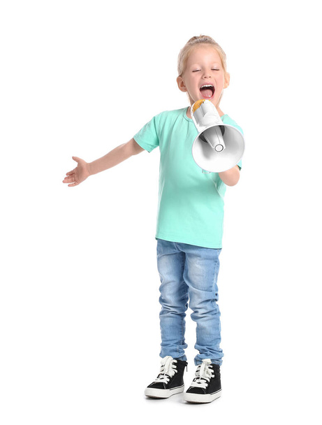 Funny little girl shouting into megaphone on white background - 写真・画像