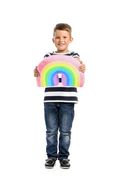 Cute little boy with toy rainbow on white background - Foto, Imagen