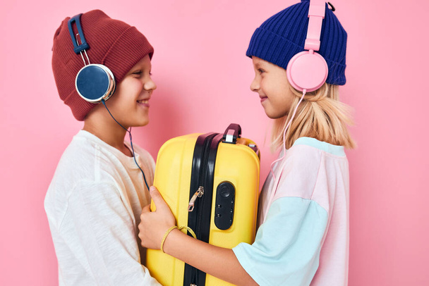 adorable little kids stylish clothes suitcase headphones studio posing - Photo, Image